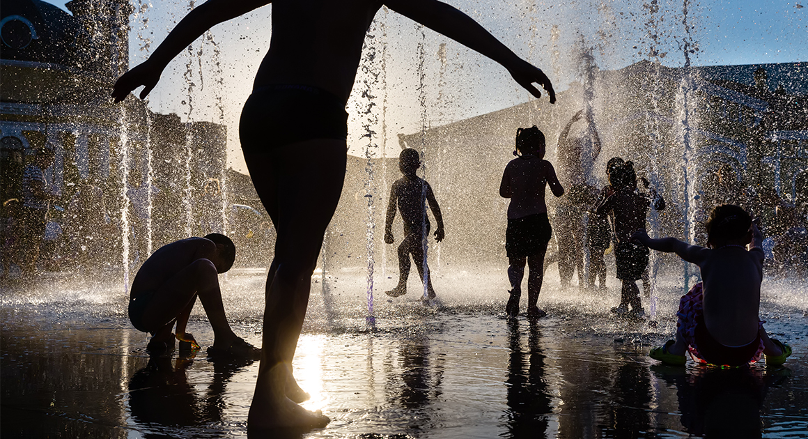 children playing in a fountain