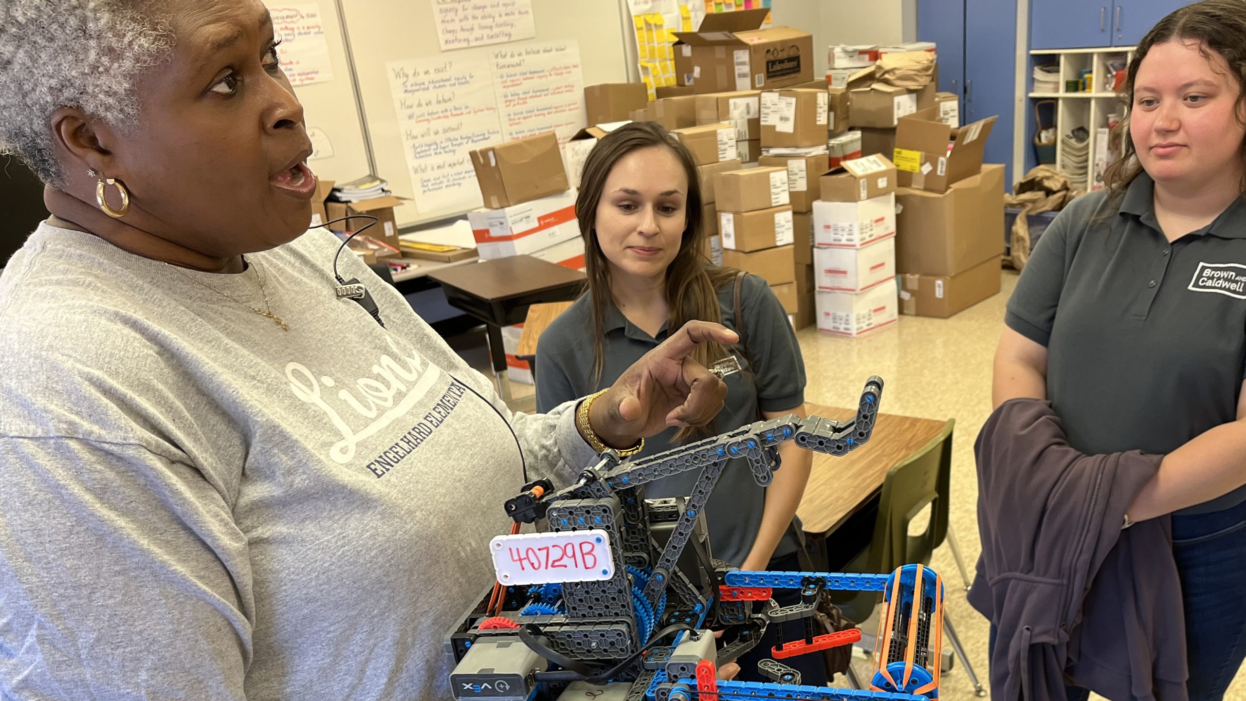 Engelhard’s Family Resource Center Coordinator Regina Jackson-Willis shows Louisville, Kentucky, BCers the school's robot.