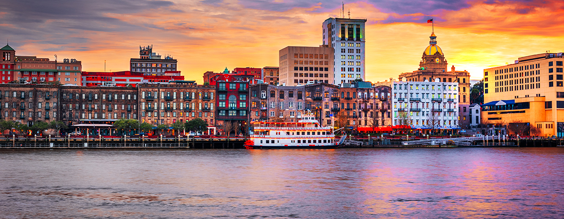 Savannah, Georgia, USA skyline on the Savannah River at dusk.